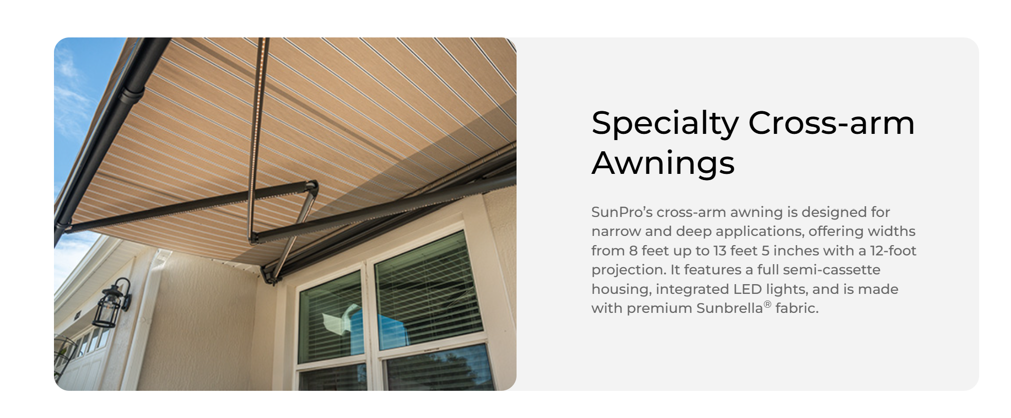 Specialty SunPro cross-arm retractable awning installed over windows