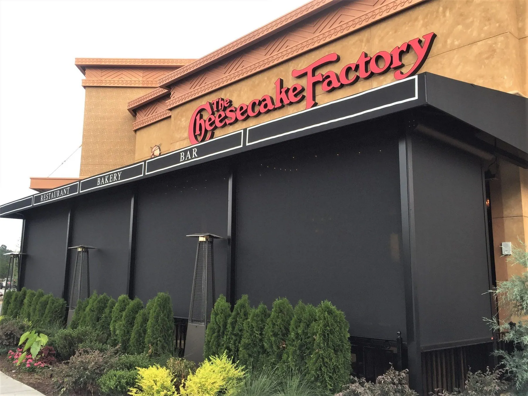 Restaurant entrance framed by dark weather screens