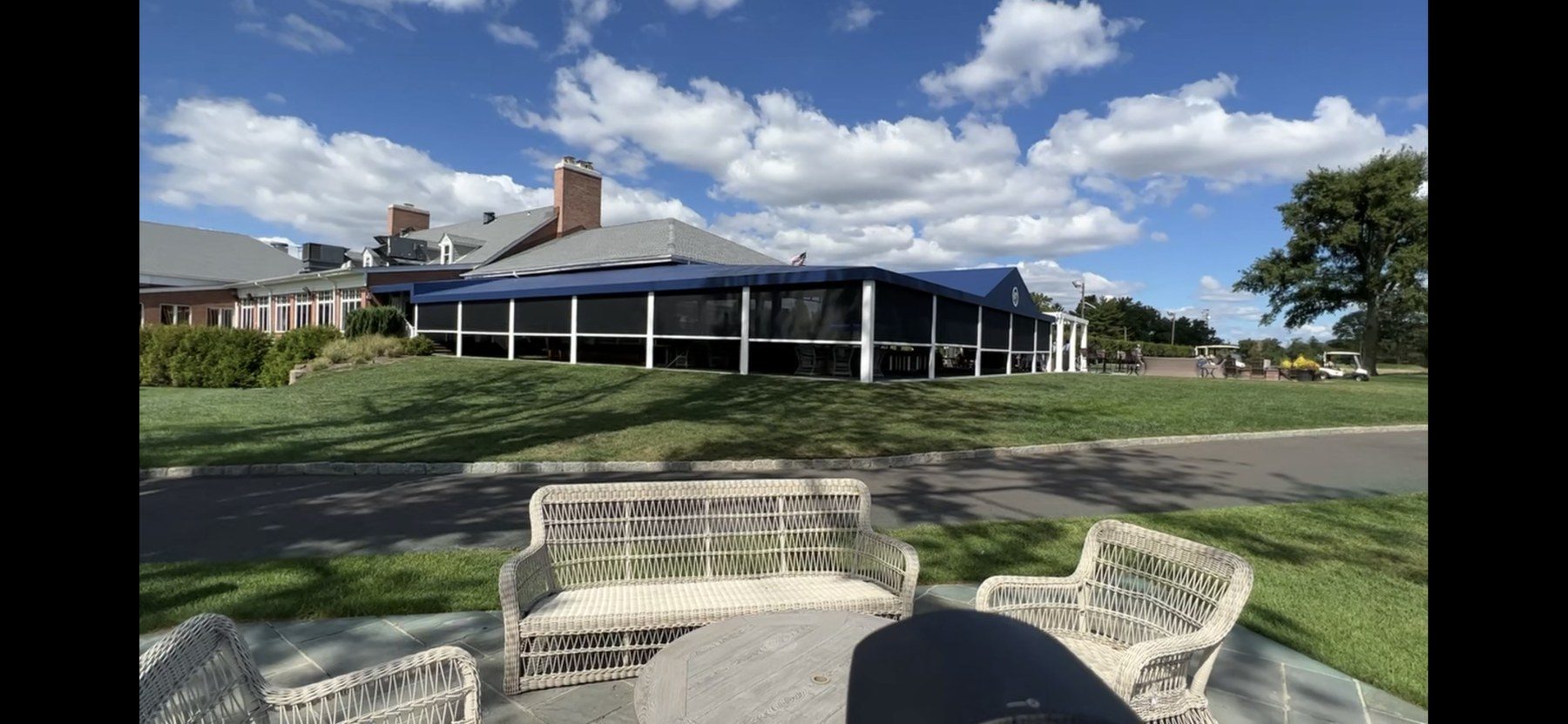 Clubhouse patio enclosed with dark commercial screens