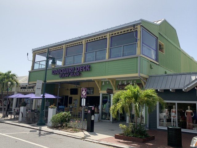 Elevated restaurant deck with blue screens