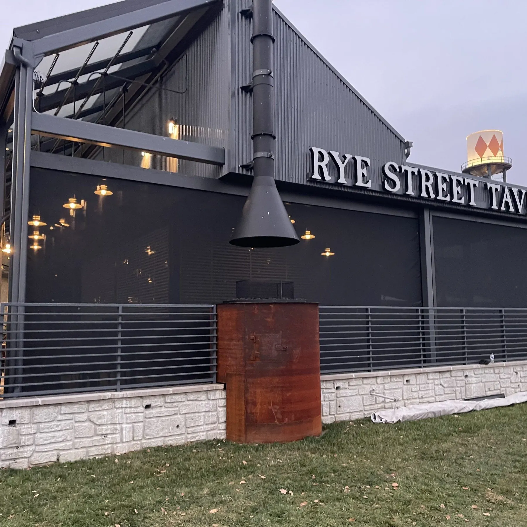 Restaurant patio protected with dark commercial screens