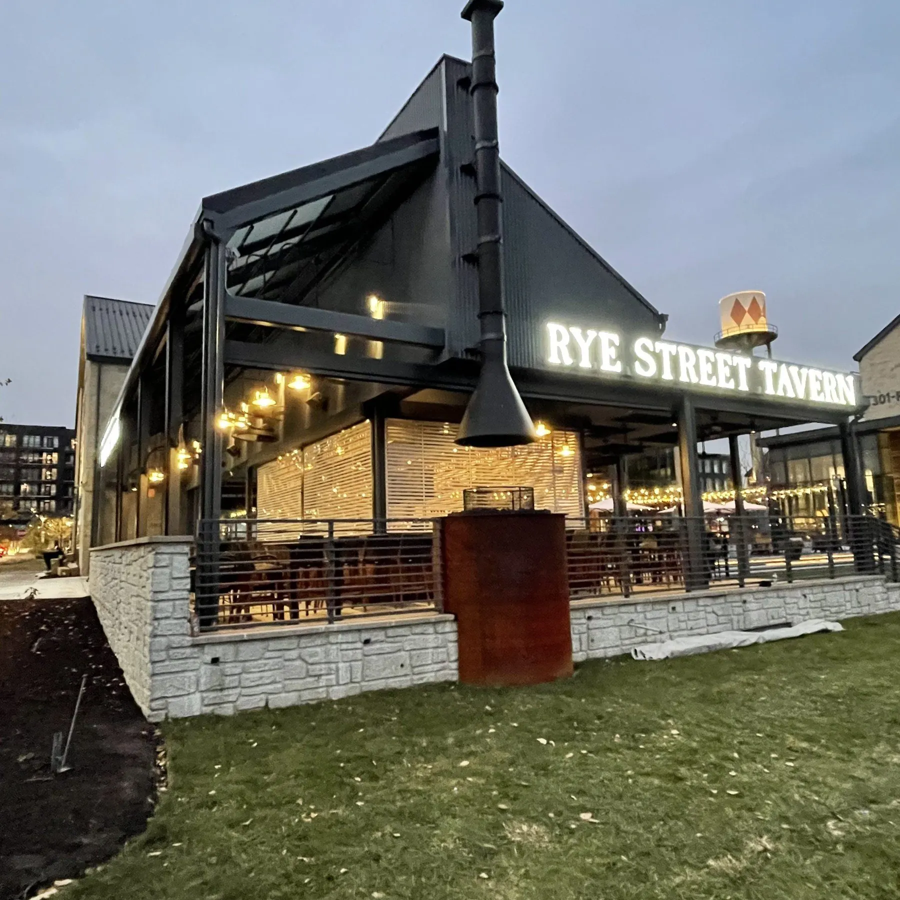 Restaurant patio in the evening with screens open