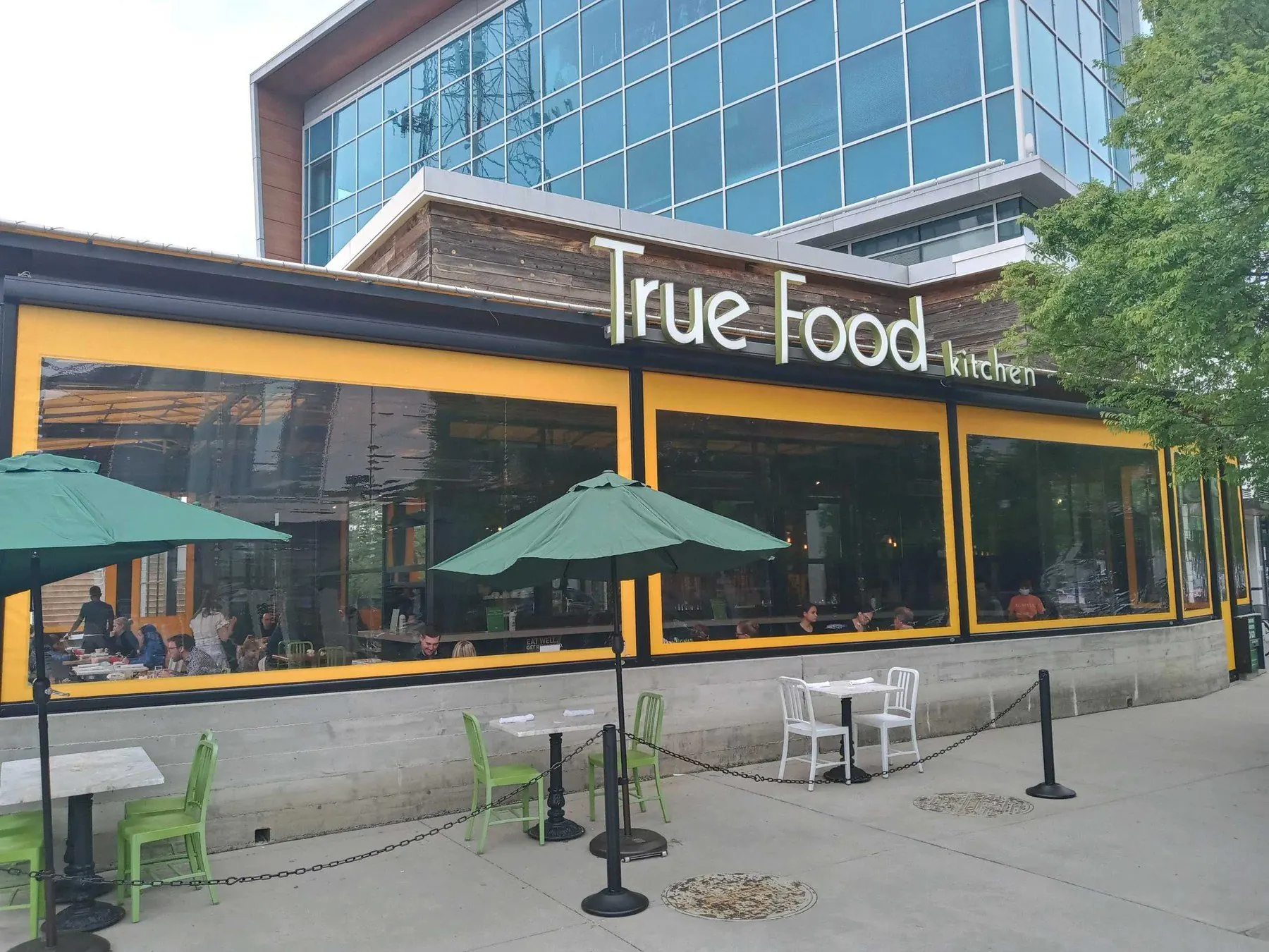 Restaurant storefront with large screened patio openings